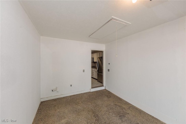 6131 Center St Unit 106, Mentor, OH 44060 - spare room featuring attic access and carpet floors