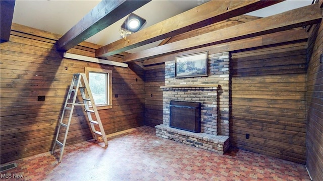 1811 Randolph Rd, Mogadore, OH 44260 - unfurnished living room with wood walls, beam ceiling, and a brick fireplace