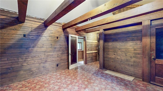 1811 Randolph Rd, Mogadore, OH 44260 - unfurnished room with wood walls, beam ceiling, and tile patterned floors