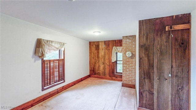 1811 Randolph Rd, Mogadore, OH 44260 - unfurnished room featuring carpet floors and wooden walls