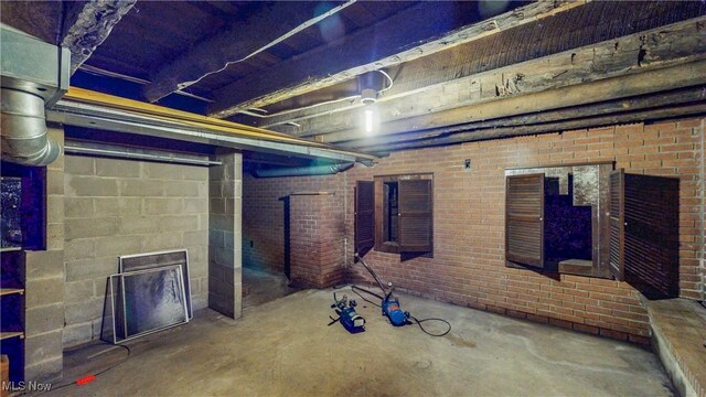 1811 Randolph Rd, Mogadore, OH 44260 - unfinished basement featuring a fireplace and brick wall