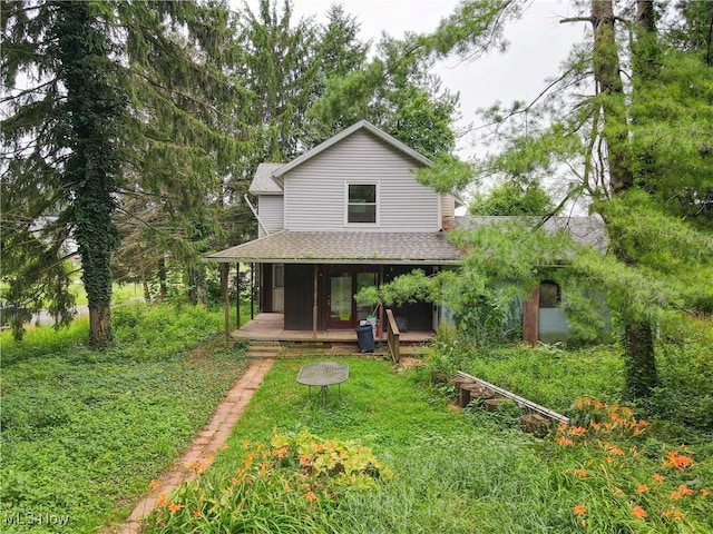 1811 Randolph Rd, Mogadore, OH 44260 - view of front of house with a shingled roof and covered porch