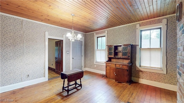 1811 Randolph Rd, Mogadore, OH 44260 - dining area featuring ornamental molding, a chandelier, light wood-type flooring, wallpapered walls, and wood ceiling