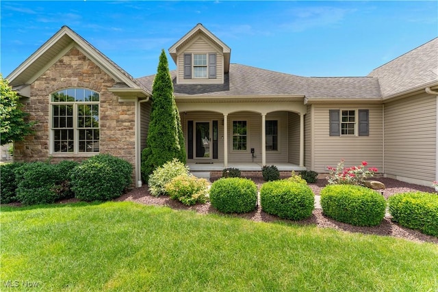 4053 Thats Life Ln, Canfield, OH 44406 - view of front of property with a front lawn, a porch, stone siding, and a shingled roof