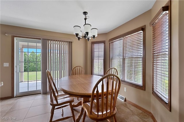 4053 Thats Life Ln, Canfield, OH 44406 - dining space featuring plenty of natural light, a chandelier, and light tile patterned floors