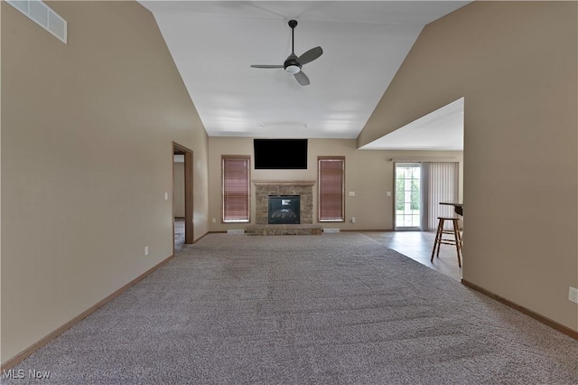 4053 Thats Life Ln, Canfield, OH 44406 - unfurnished living room featuring a ceiling fan, high vaulted ceiling, carpet, and a glass covered fireplace