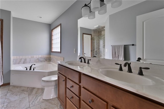 4053 Thats Life Ln, Canfield, OH 44406 - bathroom with double vanity, a shower stall, and a garden tub