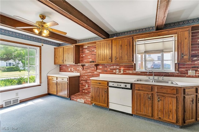 700 Alice St, East Palestine, OH 44413 - kitchen with white dishwasher, light carpet, beamed ceiling, a ceiling fan, and brown cabinetry