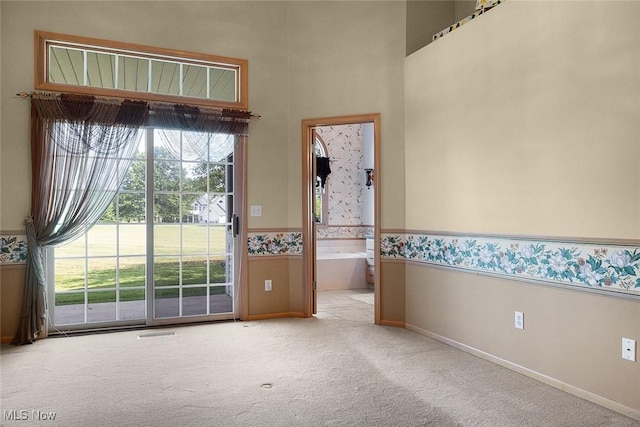 20 Golf View Ln, North Olmsted, OH 44070 - empty room with carpet flooring, a high ceiling, and a wainscoted wall