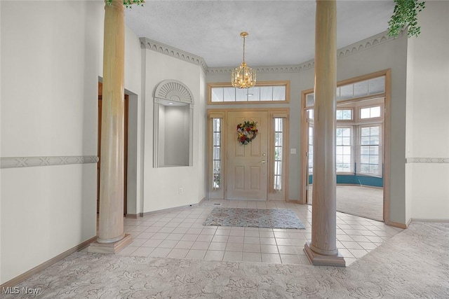 20 Golf View Ln, North Olmsted, OH 44070 - tiled foyer entrance featuring ornate columns, a chandelier, and a high ceiling