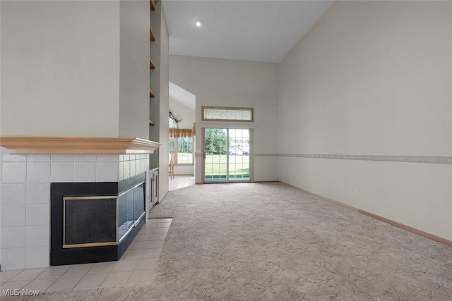20 Golf View Ln, North Olmsted, OH 44070 - unfurnished living room featuring a tile fireplace, carpet, high vaulted ceiling, and recessed lighting