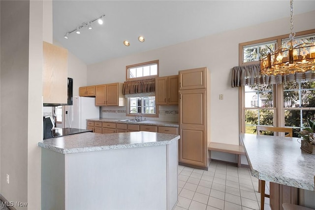 20 Golf View Ln, North Olmsted, OH 44070 - kitchen featuring a chandelier, track lighting, light countertops, light tile patterned floors, and high vaulted ceiling
