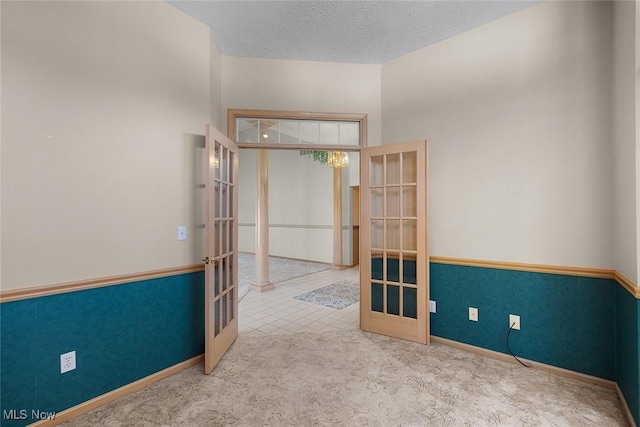 20 Golf View Ln, North Olmsted, OH 44070 - carpeted spare room featuring french doors and a textured ceiling