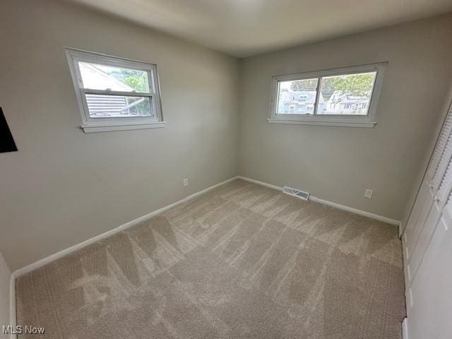 30115 Regent Rd, Wickliffe, OH 44092 - empty room featuring healthy amount of natural light and light colored carpet