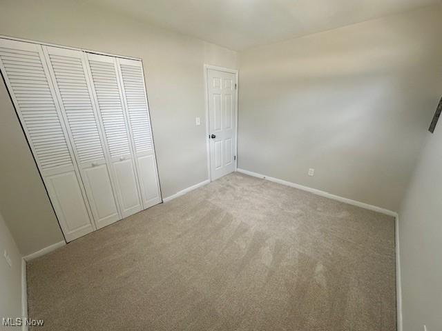 30115 Regent Rd, Wickliffe, OH 44092 - unfurnished bedroom with light carpet and a closet