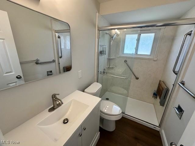 30115 Regent Rd, Wickliffe, OH 44092 - bathroom featuring a stall shower, vanity, and wood finished floors