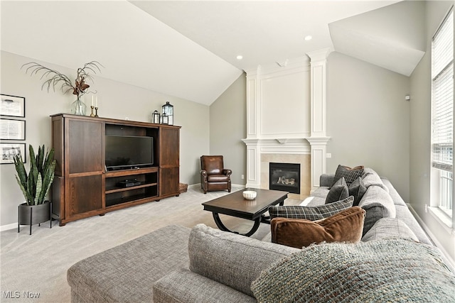 10421 Tolland Dr, Reminderville, OH 44202 - living room with light carpet, lofted ceiling, and a fireplace