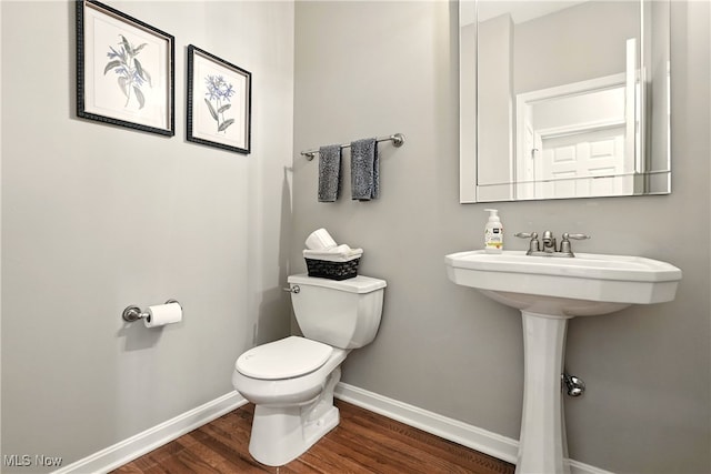 10421 Tolland Dr, Reminderville, OH 44202 - half bathroom featuring baseboards and wood finished floors
