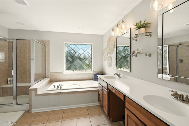 10421 Tolland Dr, Reminderville, OH 44202 - bathroom featuring double vanity, a bath, a shower stall, and tile patterned floors
