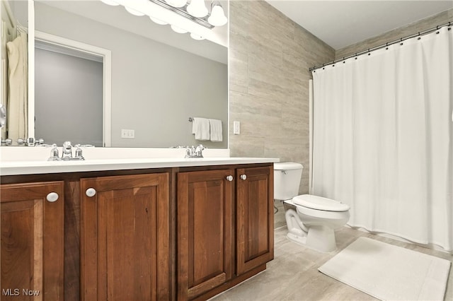 10421 Tolland Dr, Reminderville, OH 44202 - full bath with tile walls, double vanity, tile patterned floors, and a shower with curtain
