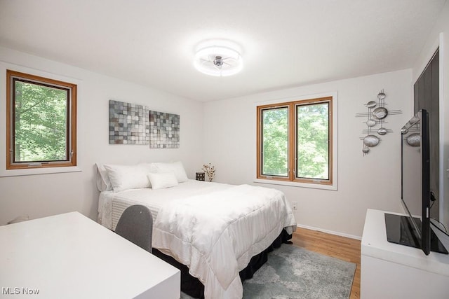 4280 Som Center Rd, Moreland Hills, OH 44022 - bedroom featuring multiple windows and light wood-style floors