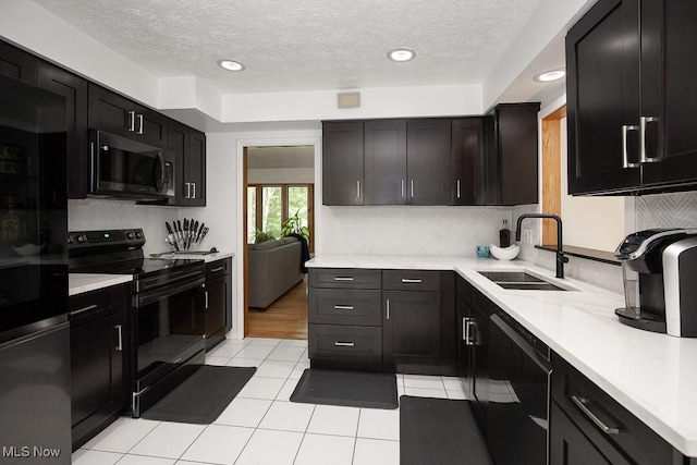 4280 Som Center Rd, Moreland Hills, OH 44022 - kitchen with black appliances, light countertops, backsplash, a textured ceiling, and recessed lighting