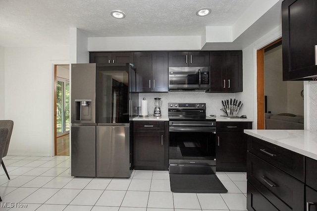 4280 Som Center Rd, Moreland Hills, OH 44022 - kitchen featuring appliances with stainless steel finishes, decorative backsplash, and a textured ceiling
