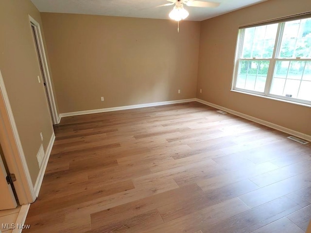 422 Dartmouth Trl, Sagamore Hills, OH 44067 - unfurnished room featuring light wood-style flooring and ceiling fan