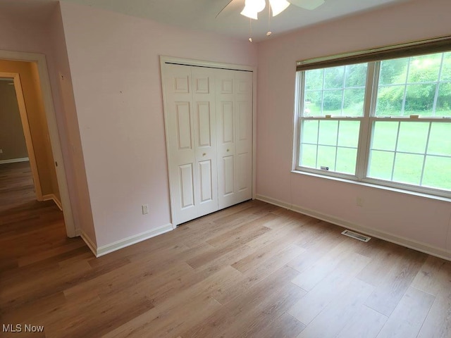 422 Dartmouth Trl, Sagamore Hills, OH 44067 - unfurnished bedroom with light wood-type flooring, a closet, and ceiling fan
