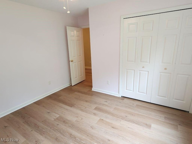 422 Dartmouth Trl, Sagamore Hills, OH 44067 - unfurnished bedroom with light wood-type flooring and a closet