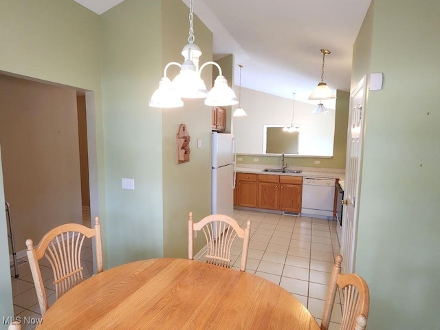 422 Dartmouth Trl, Sagamore Hills, OH 44067 - dining area with light tile patterned floors, a chandelier, and vaulted ceiling