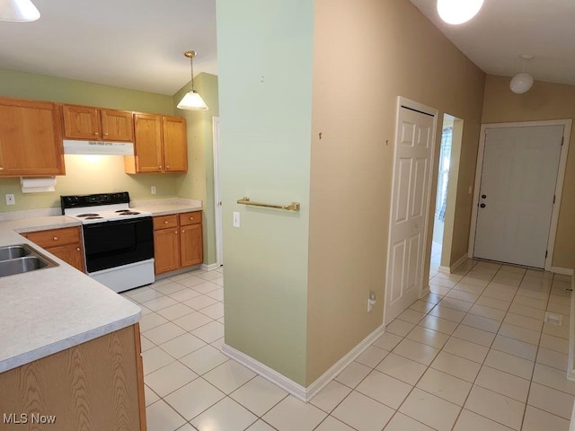 422 Dartmouth Trl, Sagamore Hills, OH 44067 - kitchen with electric stove, under cabinet range hood, light tile patterned floors, and light countertops