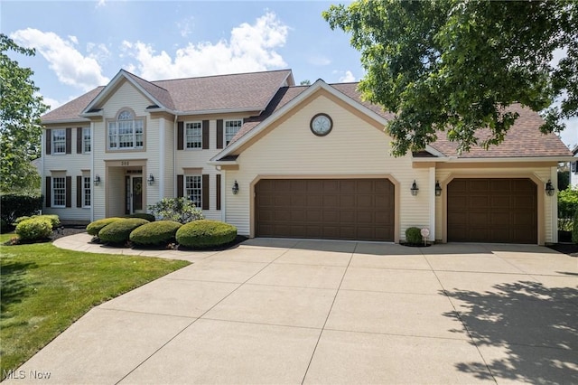 302 Brookpoint Cir, Wadsworth, OH 44281 - view of front of property with driveway, an attached garage, a front yard, and a shingled roof