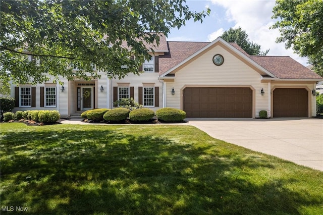 302 Brookpoint Cir, Wadsworth, OH 44281 - view of front of property with a garage, concrete driveway, a front lawn, and a shingled roof