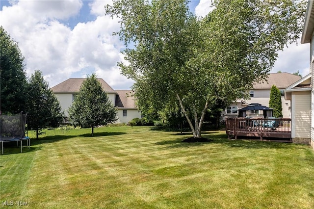 302 Brookpoint Cir, Wadsworth, OH 44281 - view of grassy yard featuring a trampoline, a gazebo, and a deck
