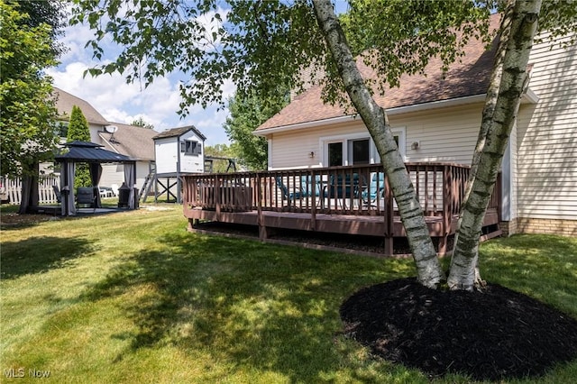 302 Brookpoint Cir, Wadsworth, OH 44281 - back of house with a shingled roof, a wooden deck, a gazebo, and a lawn