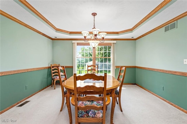 302 Brookpoint Cir, Wadsworth, OH 44281 - carpeted dining room with a raised ceiling, a chandelier, and crown molding