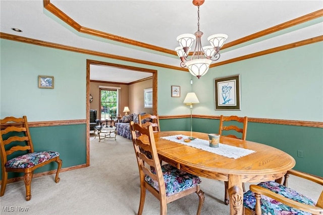 302 Brookpoint Cir, Wadsworth, OH 44281 - carpeted dining room with a tray ceiling, a chandelier, and crown molding