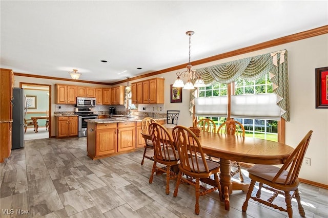 302 Brookpoint Cir, Wadsworth, OH 44281 - dining room featuring crown molding, plenty of natural light, and a chandelier