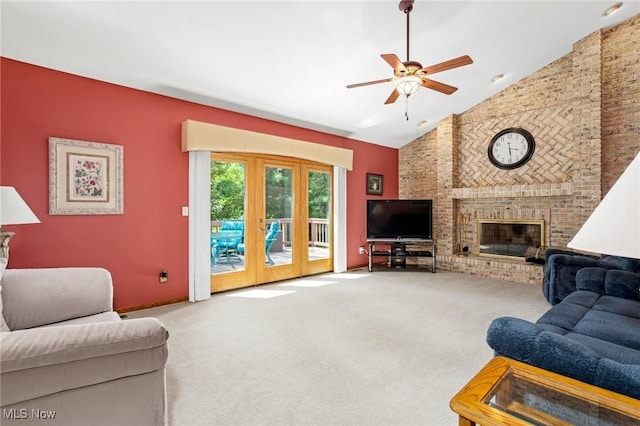 302 Brookpoint Cir, Wadsworth, OH 44281 - carpeted living area featuring french doors, a ceiling fan, a brick fireplace, and high vaulted ceiling