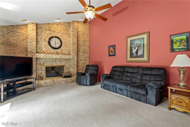 302 Brookpoint Cir, Wadsworth, OH 44281 - carpeted living area with high vaulted ceiling, ceiling fan, and a fireplace