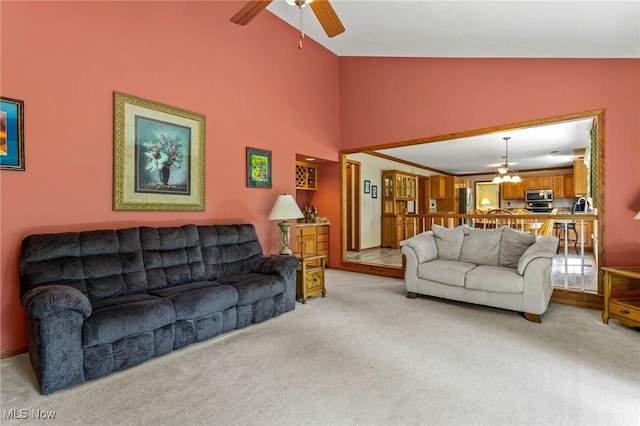 302 Brookpoint Cir, Wadsworth, OH 44281 - living room with light colored carpet, a chandelier, ceiling fan, and high vaulted ceiling