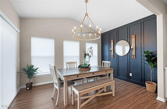 37282 Amber Way N, Ridgeville, OH 44039 - dining room with dark wood finished floors, a chandelier, and vaulted ceiling