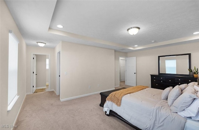 37282 Amber Way N, Ridgeville, OH 44039 - bedroom featuring a raised ceiling, light carpet, recessed lighting, and a textured ceiling