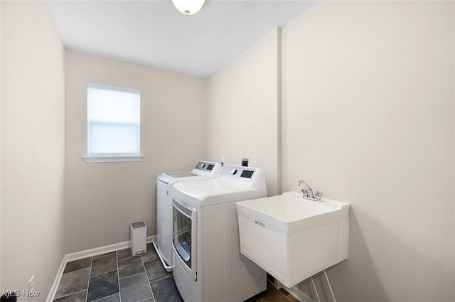 37282 Amber Way N, Ridgeville, OH 44039 - washroom with washer and clothes dryer and dark stone finish floors