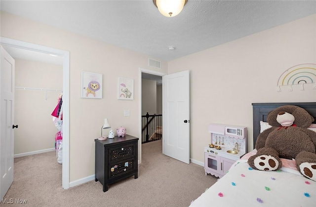 37282 Amber Way N, Ridgeville, OH 44039 - bedroom featuring light carpet, a spacious closet, and a closet