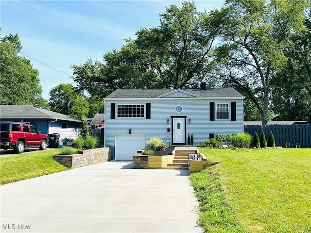 4235 Patricia Ave, Austintown, OH 44511 - bi-level home featuring concrete driveway and an attached garage