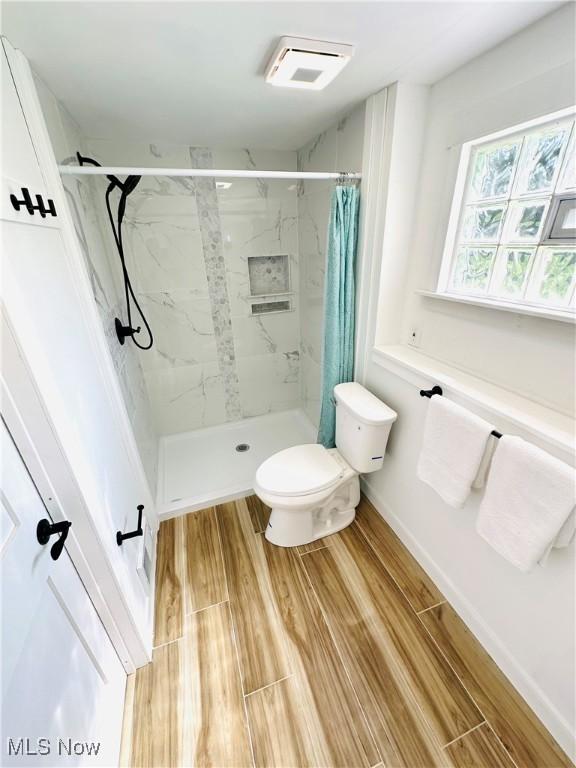 4235 Patricia Ave, Austintown, OH 44511 - bathroom with wood finished floors and a marble finish shower