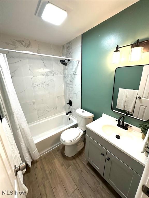 4235 Patricia Ave, Austintown, OH 44511 - bathroom with shower / bath combo with shower curtain, vanity, and wood finished floors