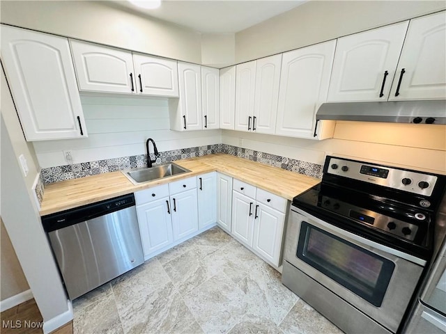 4235 Patricia Ave, Austintown, OH 44511 - kitchen with appliances with stainless steel finishes, under cabinet range hood, white cabinets, and butcher block countertops